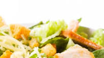 Caesar Salad with pan fried chicken, fresh shaved parmesan and croutons Caesar Salad with pan fried chicken, fresh shaved parmesan and croutons