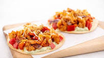 Blackened Shrimp Tostadas with creamy guacamole and cheddar-jack cheese Blackened Shrimp Tostadas with creamy guacamole and cheddar-jack cheese