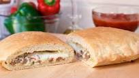 Cheesy Sausage and Pepper Calzone Cheesy Sausage and Pepper Calzone