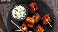 Bourbon-glazed pork belly chunks Bourbon-glazed pork belly chunks