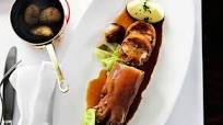 Braised stuffed pig's trotters with cabbage, shallots and potato purée Braised stuffed pig's trotters with cabbage, shallots and potato purée