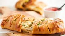 Italian Sausage Stromboli with spinach-mozzarella filling and marinara dipping sauce Italian Sausage Stromboli with spinach-mozzarella filling and marinara dipping sauce
