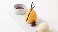 Spiced poached pears with hot chocolate sauce and vanilla ice cream Spiced poached pears with hot chocolate sauce and vanilla ice cream