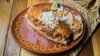 Torta mexicana de carnitas de cerdo Torta mexicana de carnitas de cerdo