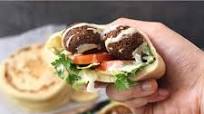 FALAFEL PITA SANDWICH WITH TAHINI SAUCE FALAFEL PITA SANDWICH WITH TAHINI SAUCE