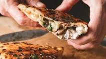 Mushroom and ricotta calzone with garlic butter Mushroom and ricotta calzone with garlic butter
