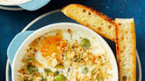 Creamy Baked Eggs with Olives and Crispy Focaccia Crumbs Creamy Baked Eggs with Olives and Crispy Focaccia Crumbs