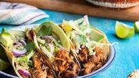 Pork carnitas tacos with cabbage slaw and avocado Pork carnitas tacos with cabbage slaw and avocado