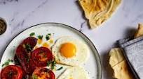 Sucuk with egg and tomato - Levantine breakfast Sucuk with egg and tomato - Levantine breakfast