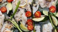 Oven-baked tilapia with zucchini and asparagus Oven-baked tilapia with zucchini and asparagus