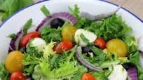 Mediterranean salad with cherry tomatoes, black olives, mozzarella and basil Mediterranean salad with cherry tomatoes, black olives, mozzarella and basil