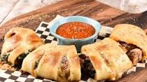 East Coast Veggie Stromboli with spinach, cremini mushrooms, and garlic-butter crust East Coast Veggie Stromboli with spinach, cremini mushrooms, and garlic-butter crust