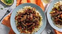 Puerto Rican steak and onions over cauliflower Puerto Rican steak and onions over cauliflower