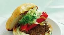 Lamb burger with tzatziki, roasted red pepper and coriander sprouts Lamb burger with tzatziki, roasted red pepper and coriander sprouts