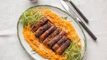Crispy slow-cooked pork belly with pumpkin mash and black sesame Crispy slow-cooked pork belly with pumpkin mash and black sesame
