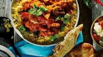 Kip Tikka Masala met gele rijst en naanbrood Kip Tikka Masala met gele rijst en naanbrood
