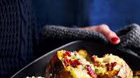 Baked potatoes stuffed with bacon, cheese and chives Baked potatoes stuffed with bacon, cheese and chives