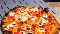 Outdoor Pizza Oven Burst Cherry Tomato, Shallot, and Herb Pizza Outdoor Pizza Oven Burst Cherry Tomato, Shallot, and Herb Pizza