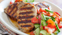 Grilled Greek-Style Pork Chops with Tomato-Cucumber Salad Grilled Greek-Style Pork Chops with Tomato-Cucumber Salad