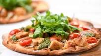 Pesto Chicken Pizza with mozzarella, grape tomatoes, and arugula Pesto Chicken Pizza with mozzarella, grape tomatoes, and arugula