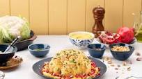 Coliflor asada con hummus y granada Coliflor asada con hummus y granada