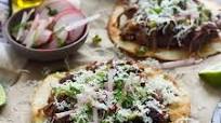 Puffy Tostadas with Chile and Beer Braised Short Rib and Tomatilla Salsa Puffy Tostadas with Chile and Beer Braised Short Rib and Tomatilla Salsa