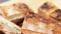 Pork Carnitas and Oaxaca Cheese Shooter's-Style Sandwich With Spicy Refried Beans and Pickled Red Onions Recipe Pork Carnitas and Oaxaca Cheese Shooter's-Style Sandwich With Spicy Refried Beans and Pickled Red Onions Recipe