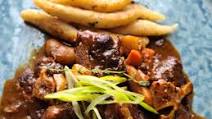 Guinness-Braised Oxtail with Pan-Fried Spinners Guinness-Braised Oxtail with Pan-Fried Spinners