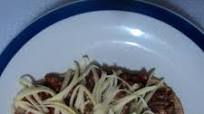 Huarache asado de birria de pollo adobada al tequila con queso tipo San Diego. Jalisco México Huarache asado de birria de pollo adobada al tequila con queso tipo San Diego. Jalisco México