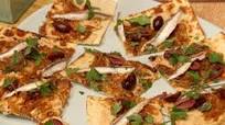 Flatbread with White Bean Hummus, Caramelized Onions, Black Olives and Spanish White Anchovies Flatbread with White Bean Hummus, Caramelized Onions, Black Olives and Spanish White Anchovies