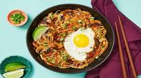 Szechuan Noodles with Mushrooms & Carrot topped with a Fried Egg Szechuan Noodles with Mushrooms & Carrot topped with a Fried Egg