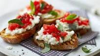Tomato crostini topped with cottage cheese Tomato crostini topped with cottage cheese