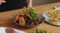 Caribbean beef stew with fried vegetables and roti Caribbean beef stew with fried vegetables and roti