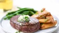 Sirloin Steak with Blue Cheese Compound Butter with green beans and roasted fingerling potatoes Sirloin Steak with Blue Cheese Compound Butter with green beans and roasted fingerling potatoes