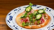 Tuna sashimi pizza with truffle ponzu and wasabi tobiko Tuna sashimi pizza with truffle ponzu and wasabi tobiko