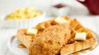 Buttery Chicken and Waffles with scrambled eggs and hot sauce Buttery Chicken and Waffles with scrambled eggs and hot sauce