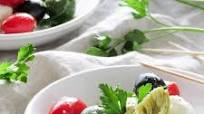 Caprese Salad with Cherry Tomatoes Olives and Marinated Artichoke Hearts Caprese Salad with Cherry Tomatoes Olives and Marinated Artichoke Hearts