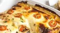 Refried bean enchiladas with jalapeno cheese sauce Refried bean enchiladas with jalapeno cheese sauce