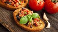 Italian bruschetta snacks with tuna, olives and tomatoes Italian bruschetta snacks with tuna, olives and tomatoes