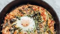 White Skillet Pizza with Spring Greens and an Egg White Skillet Pizza with Spring Greens and an Egg