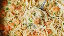Garlic Shrimp Alfredo in a Creamy Four Cheese Pasta Sauce Garlic Shrimp Alfredo in a Creamy Four Cheese Pasta Sauce
