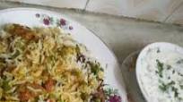 Veg Hyderabadi biryani with raita Veg Hyderabadi biryani with raita
