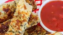 Cheesy Garlic Breadsticks Made with Pizza Dough Cheesy Garlic Breadsticks Made with Pizza Dough
