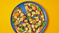 Two-Cheese Margherita Pizzas with Cherry Tomatoes and Basil Two-Cheese Margherita Pizzas with Cherry Tomatoes and Basil