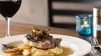 Bone- In Grilled Pork Chop with Bacon Poached Potatoes Bone- In Grilled Pork Chop with Bacon Poached Potatoes