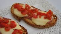 Bruschette filanti con prosciutto cotto Bruschette filanti con prosciutto cotto