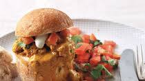 Butter chicken bunny chow with tomato and yoghurt