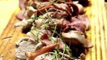 Bacon wrapped pork fillets served on a bed of mustard mash Bacon wrapped pork fillets served on a bed of mustard mash