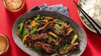 Mongolian beef and spinach stir-fry over steamed rice Mongolian beef and spinach stir-fry over steamed rice