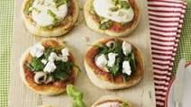 Mini pizzas with various toppings Mini pizzas with various toppings